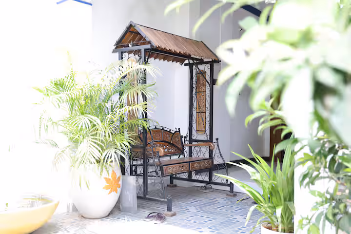 Wooden swing at Nivaa Stays entrance