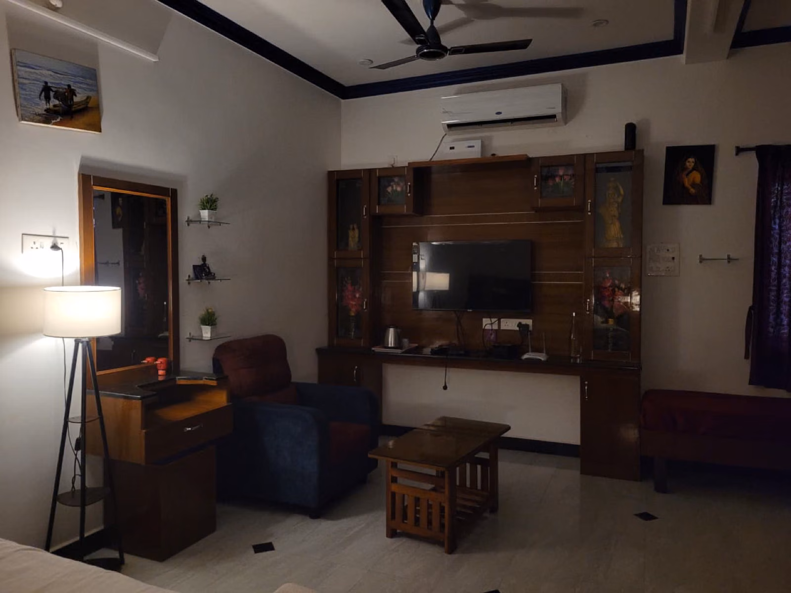 Living room in the evening with TV unit and warm lighting